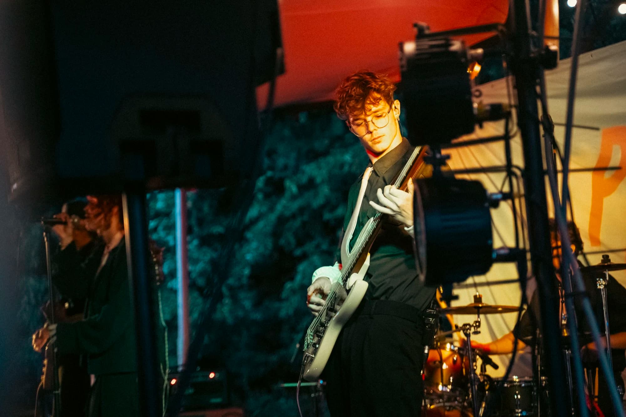 Maarten playing bass on stage during a concert